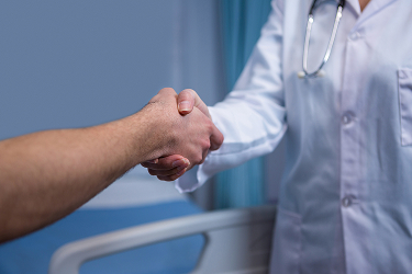 Image doctor handshake with patient in hospital room 2026 03 25 00 58 03 utc 1 (1)